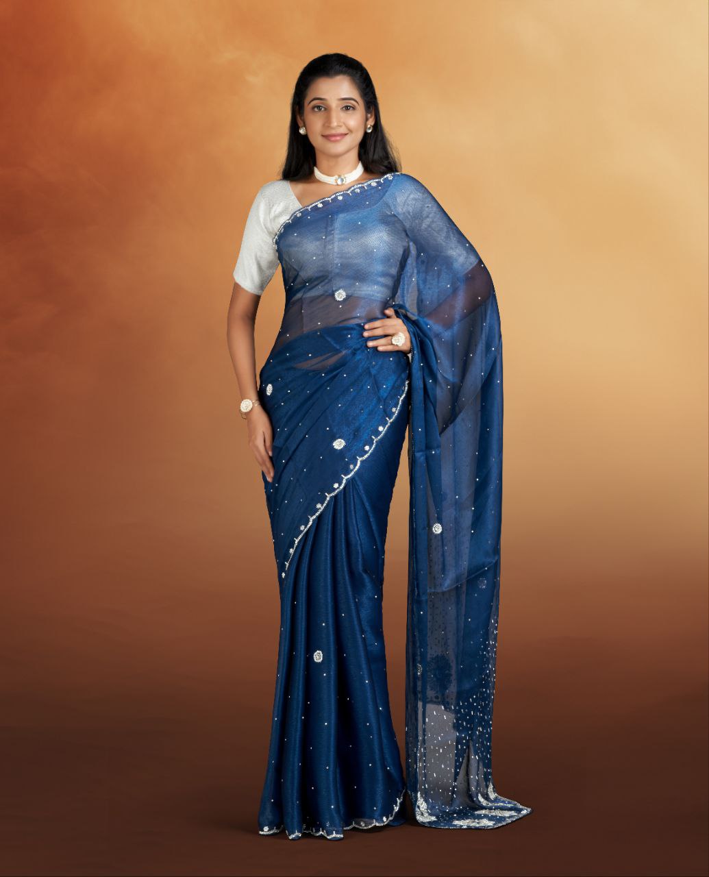 Blue color Net Saree with stonework Border