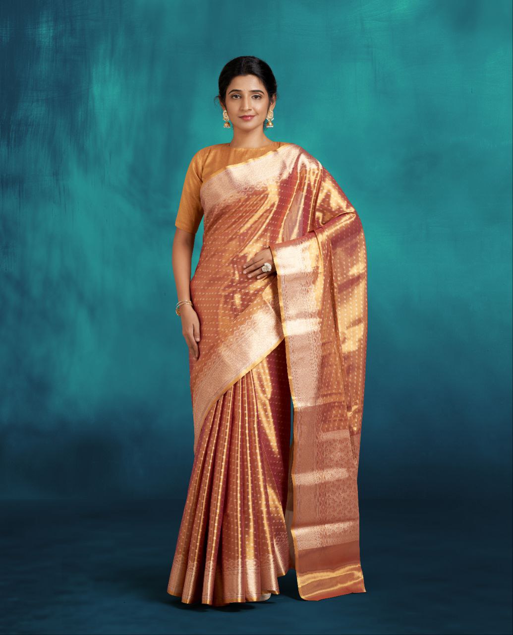 Metallic Orange Tissue Saree with Silver Buttes